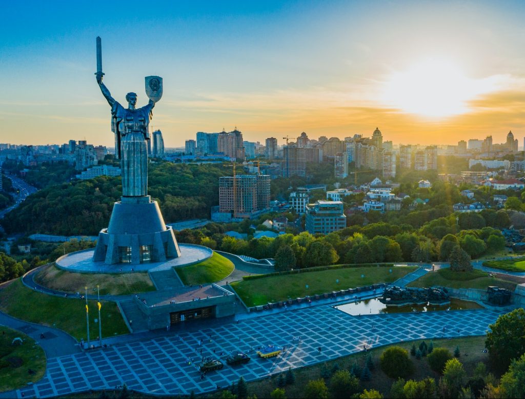 Aerial view to the Motherland statue in the Kiev while summer sunset.